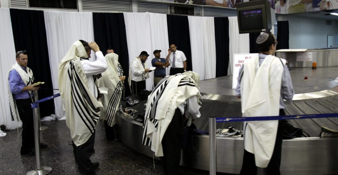 Speaking While Donning Tefillin